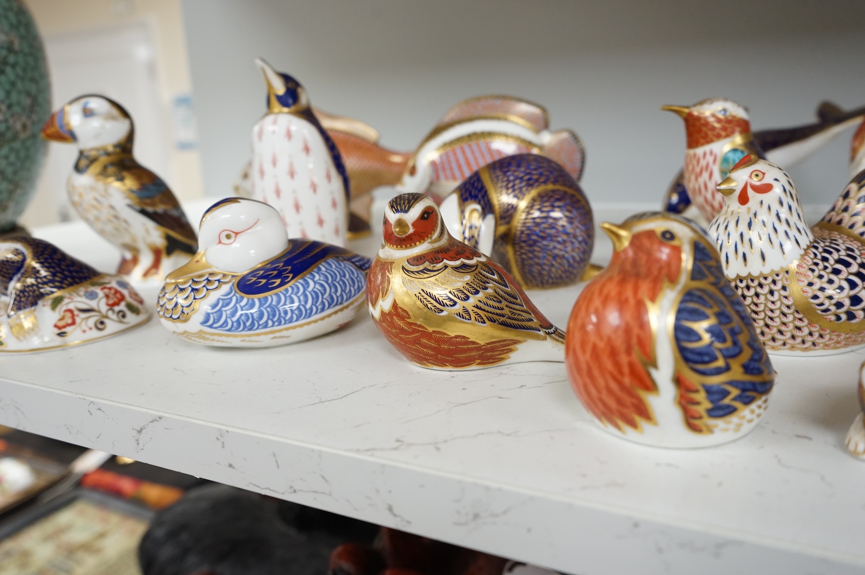A collection of Royal Crown Derby Imari animal paperweights to include cats, fish and birds, largest 14cm high